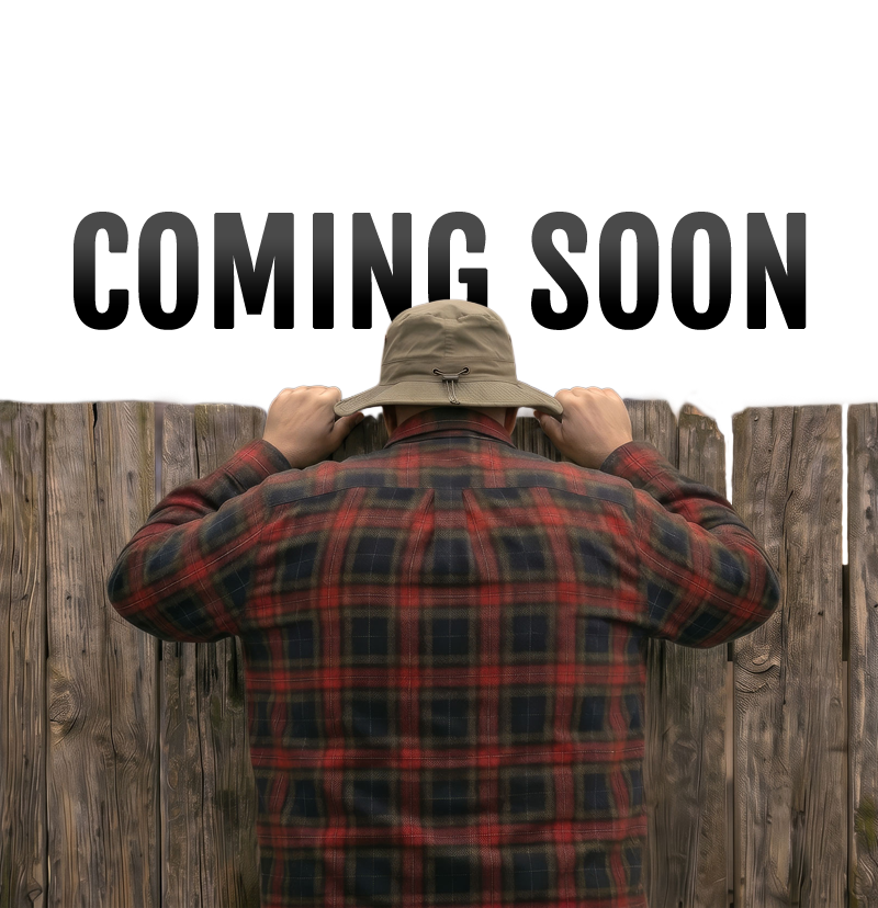 Wilson looking over fence with Coming Soon notice